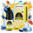 Botella de e-liquid Bombo Bar Juice Mango Energy de 10 ml con etiqueta en tonos amarillos, junto a su caja, acompañada de mango y elementos que evocan bebida energética, sugiriendo un sabor tropical, dulce y vibrante.