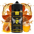 Flacon d'arôme Bombo King Crest Don Juan Sweet Tobacco de 20 ml (format 20/120 ml), avec un design noir et des détails dorés, accompagné de feuilles de tabac et de miel qui représentent sa saveur sucrée avec des notes intenses de tabac et des nuances miellées.